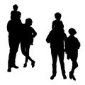 Parents with a child on dad`s shoulders, silhouettes of a married couple in full growth during